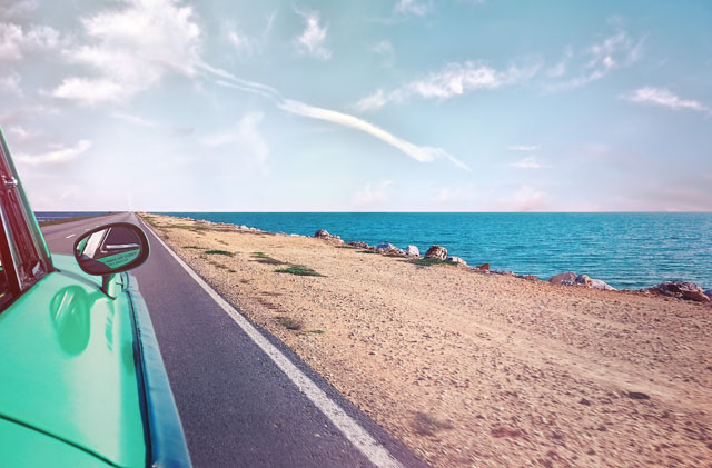 Green Car Near Seashore